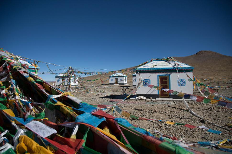 Free Image of Traditional structures with prayer flags 