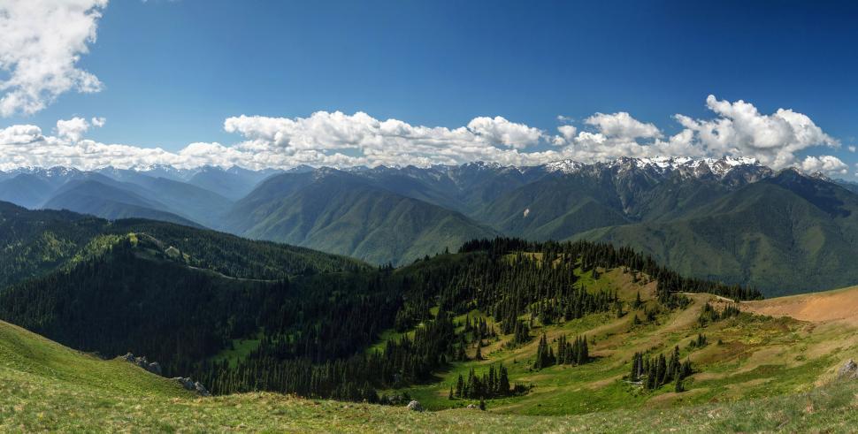 Free Image of Panoramic mountain range under blue sky 