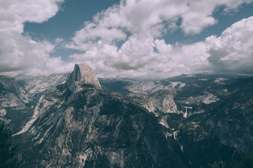 Free Image of Moody vintage-style mountain vista with clouds 