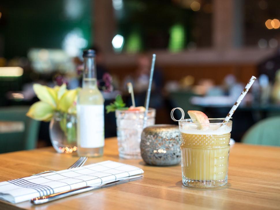 Free Image of Drinks on table in a cozy restaurant setting 