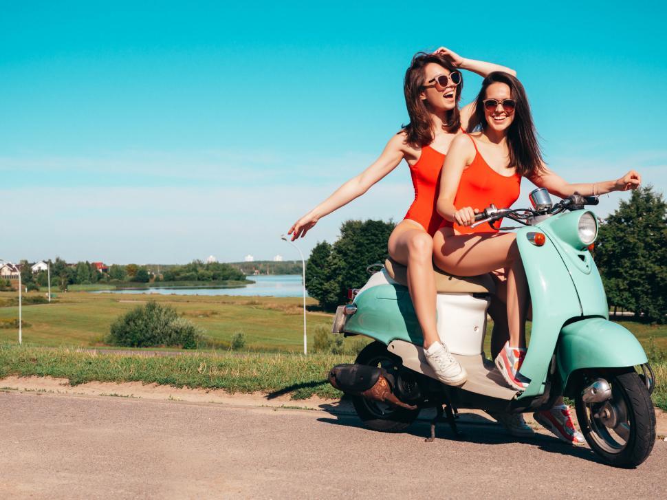 Free Image of Two women on a scooter 