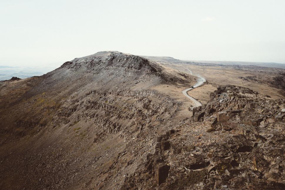 Free Image of Winding road on rocky mountain terrain 