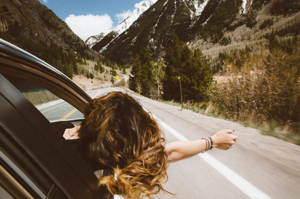 Free Image of Arm stretched out of moving car 
