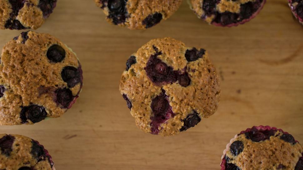 Free Image of Blueberry muffins on wooden table 