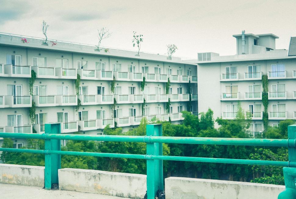 Free Image of Apartment buildings with balconies and trees 