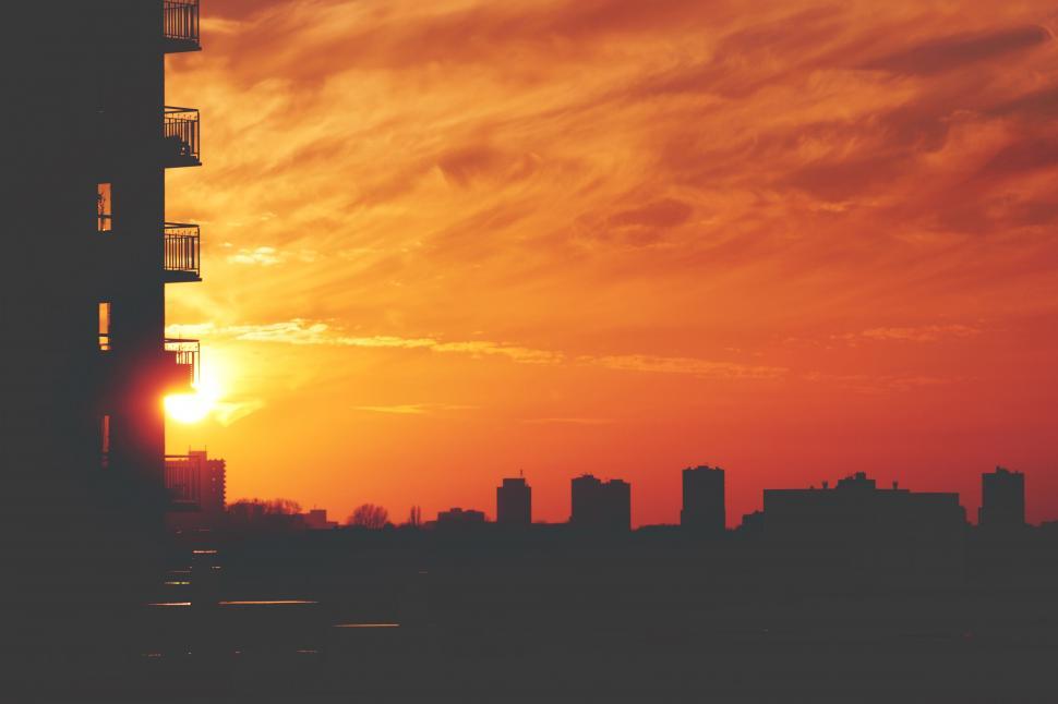 Free Image of Sunset with warm glow on urban silhouette 