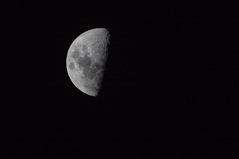 Free Image of Detailed half moon against a black sky 