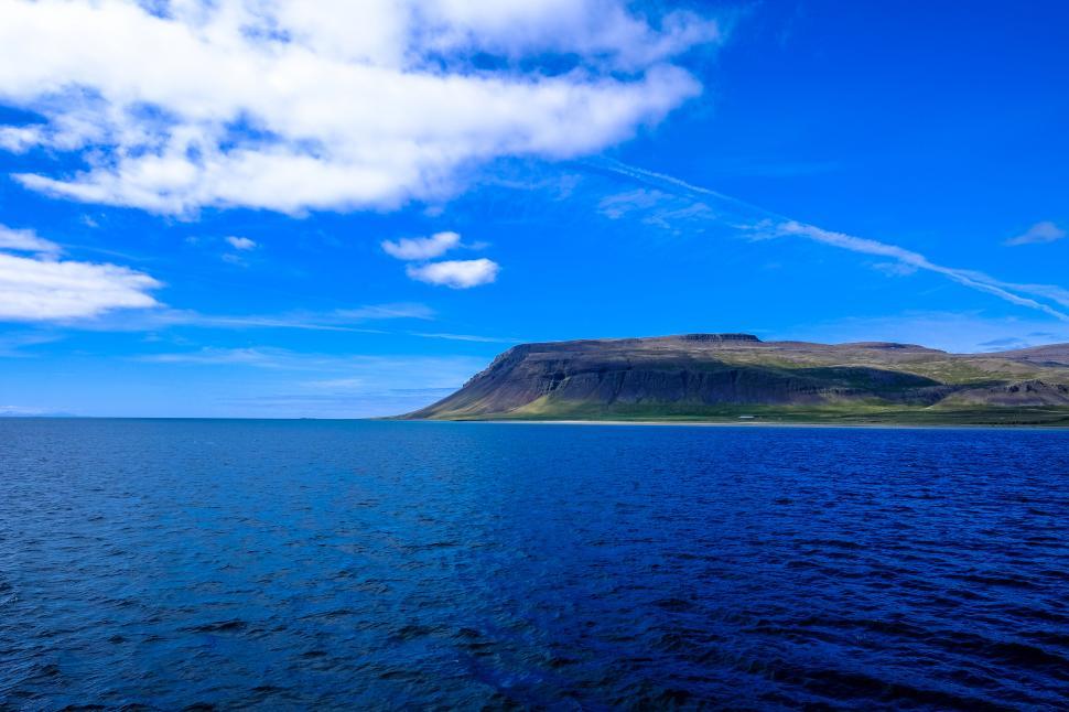 Free Image of Cliffside and ocean under a clear sky 
