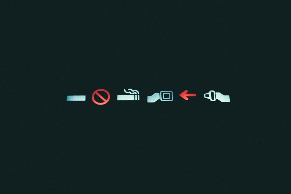 Free Image of Safety instructions on airplane seat belt 
