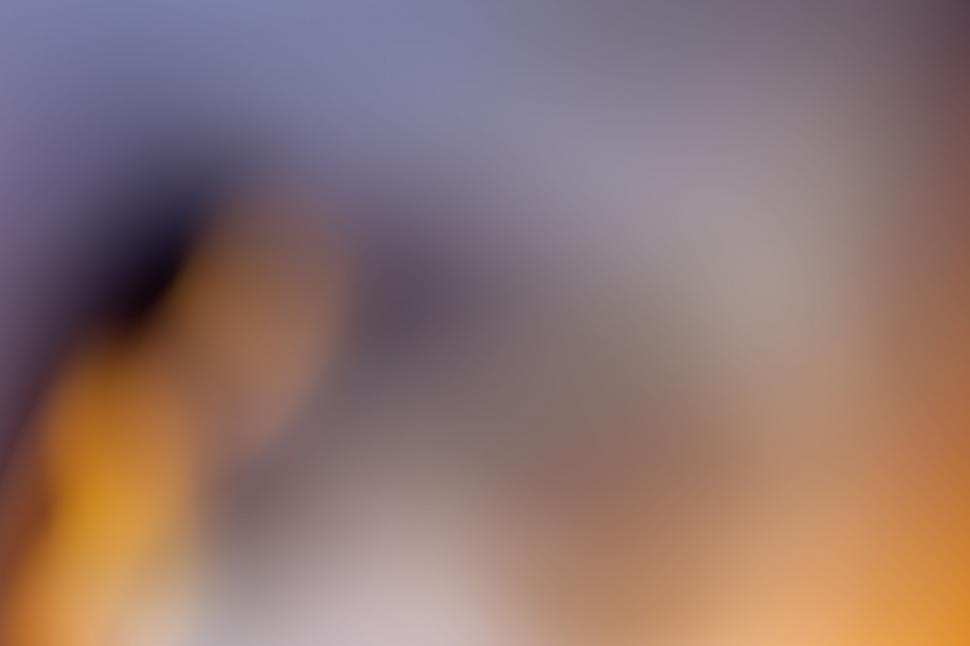 Free Image of Abstract tones of purple and orange blur 