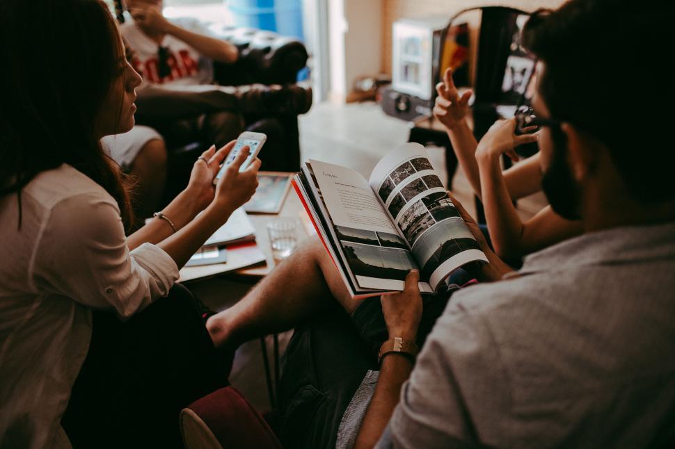 Free Image of Casual gathering with people and book 