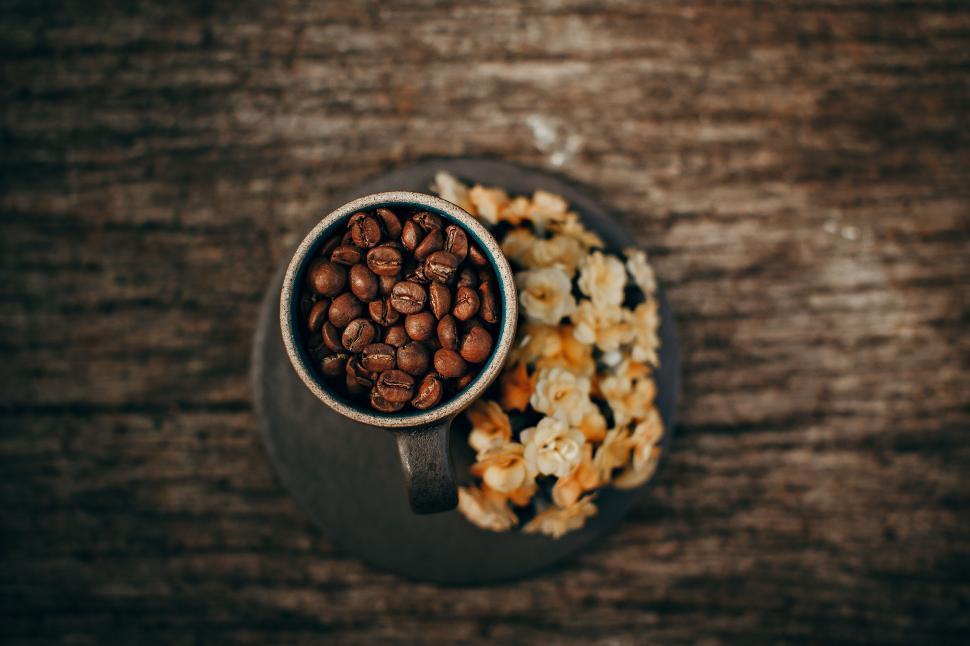 Free Image of Cup of coffee beans on wooden table 