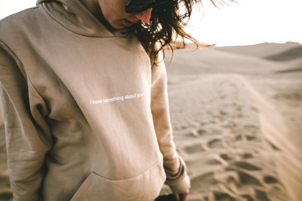 Free Image of Person in hoodie with a quirky text 