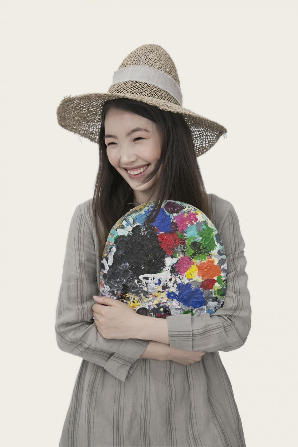 Free Image of Artist holding colorful paint palette 