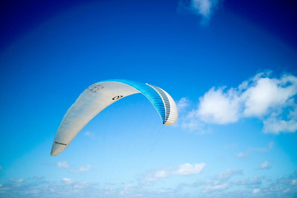 Free Image of Paraglider soaring in the clear blue sky 