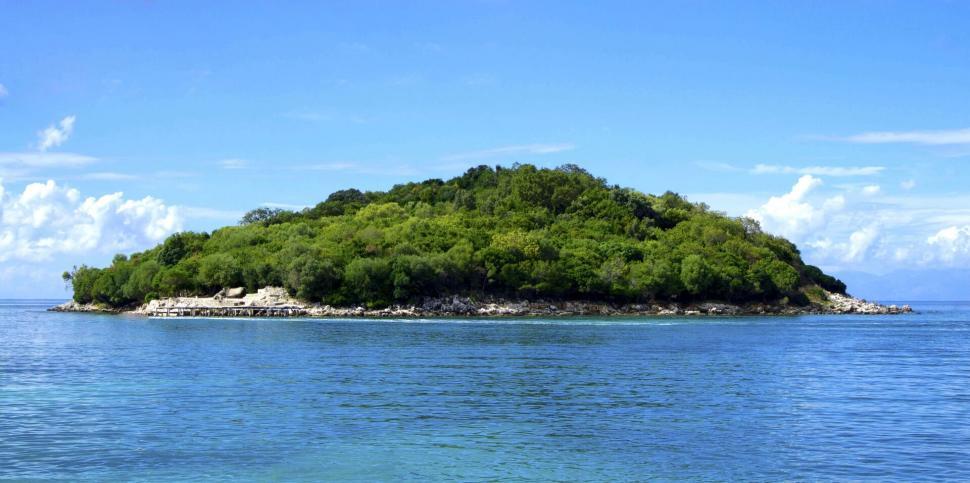 Free Image of Tropical island with lush greenery and blue sea 
