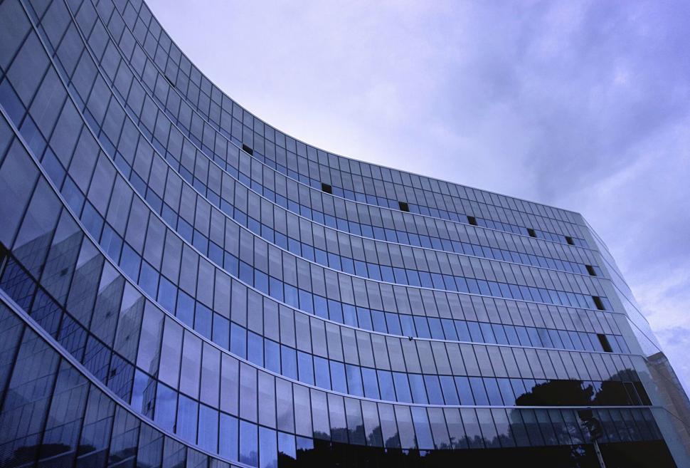 Free Image of Curved modern building with reflective glass facade 