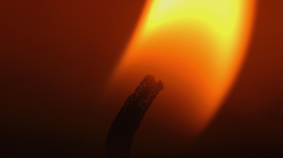 Free Image of Candle flame in darkness 