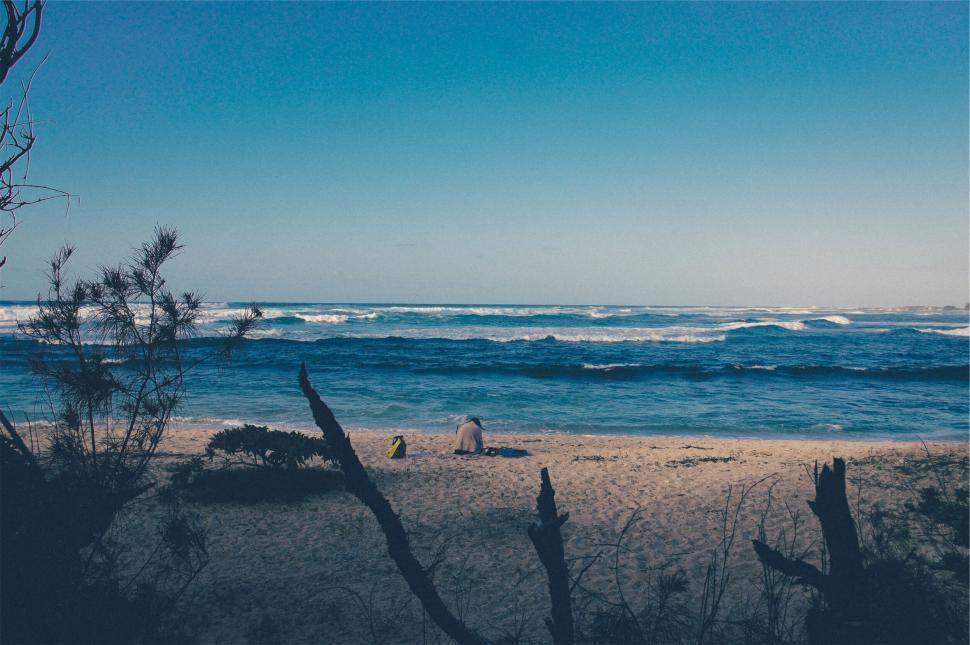 Free Image of Solitary figure on a sandy beach 