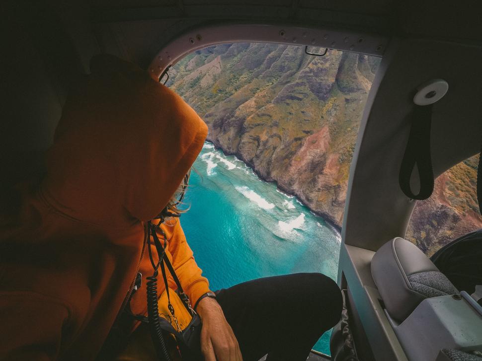 Free Image of Person viewing coastline from helicopter 
