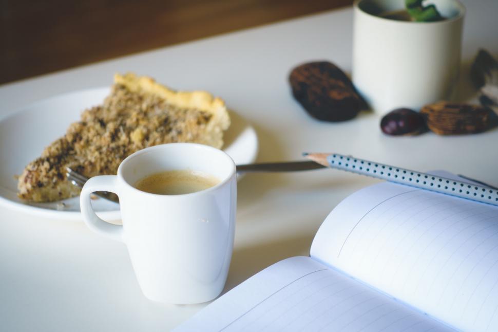 Free Image of Coffee and pie on a work desk 