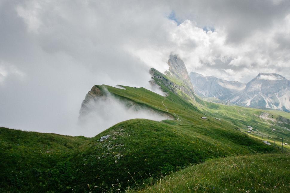 Free Image of Misty mountain landscape with green fields 