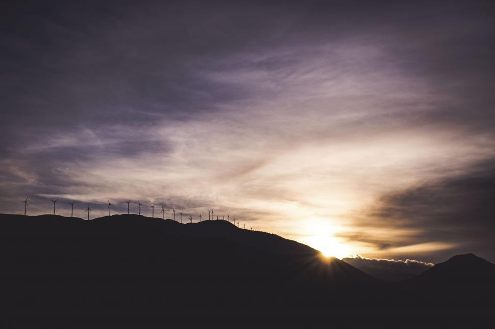 Free Image of Wind turbines at mountainous sunset 
