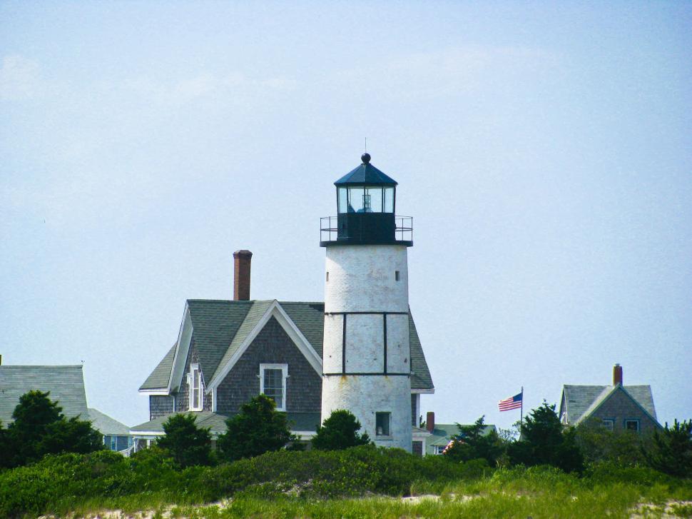 Free Image of Lighthouse overlooking a calm sea 