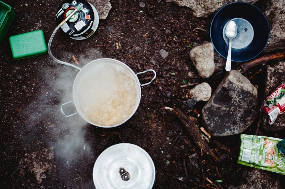 cooking gear while camping preparing food in camp hiking 
