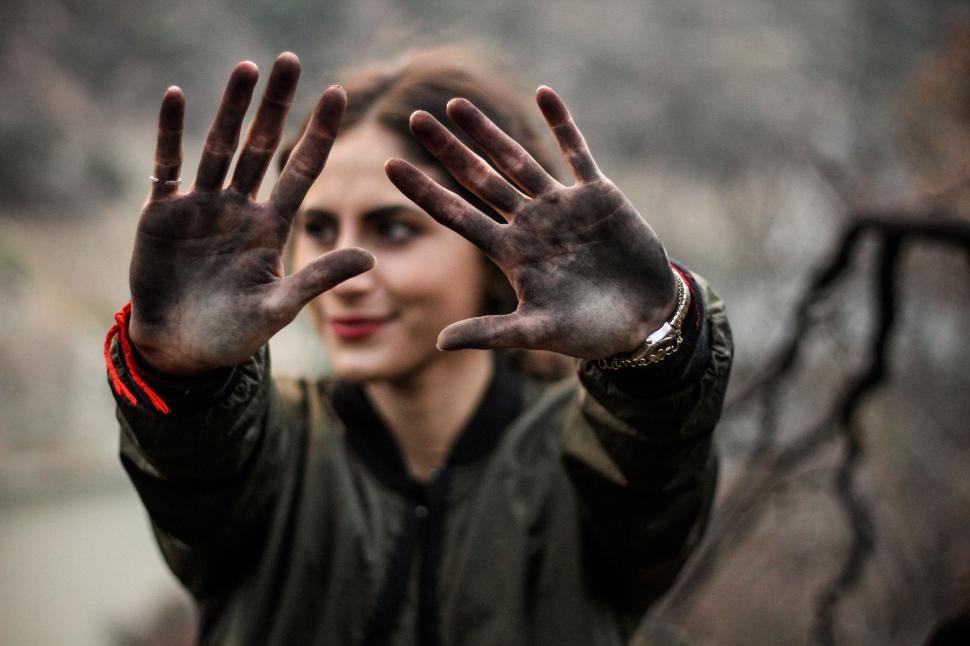 Free Image of Woman showing dirty hands to camera 