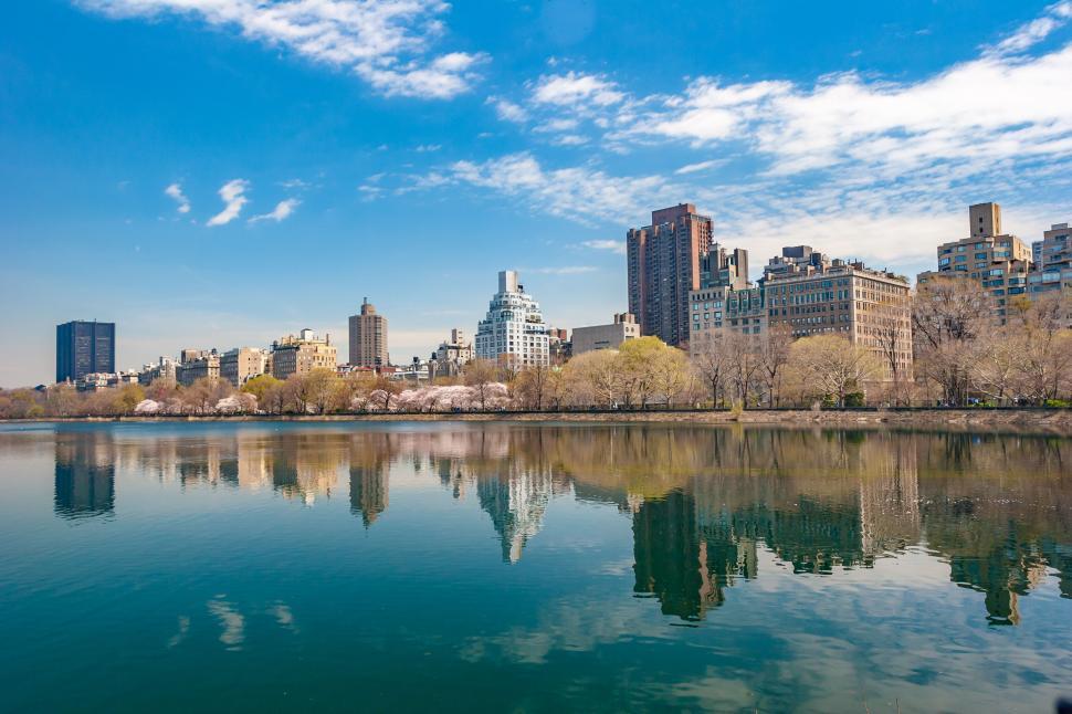 Free Image of Urban skyline reflection on calm lake 