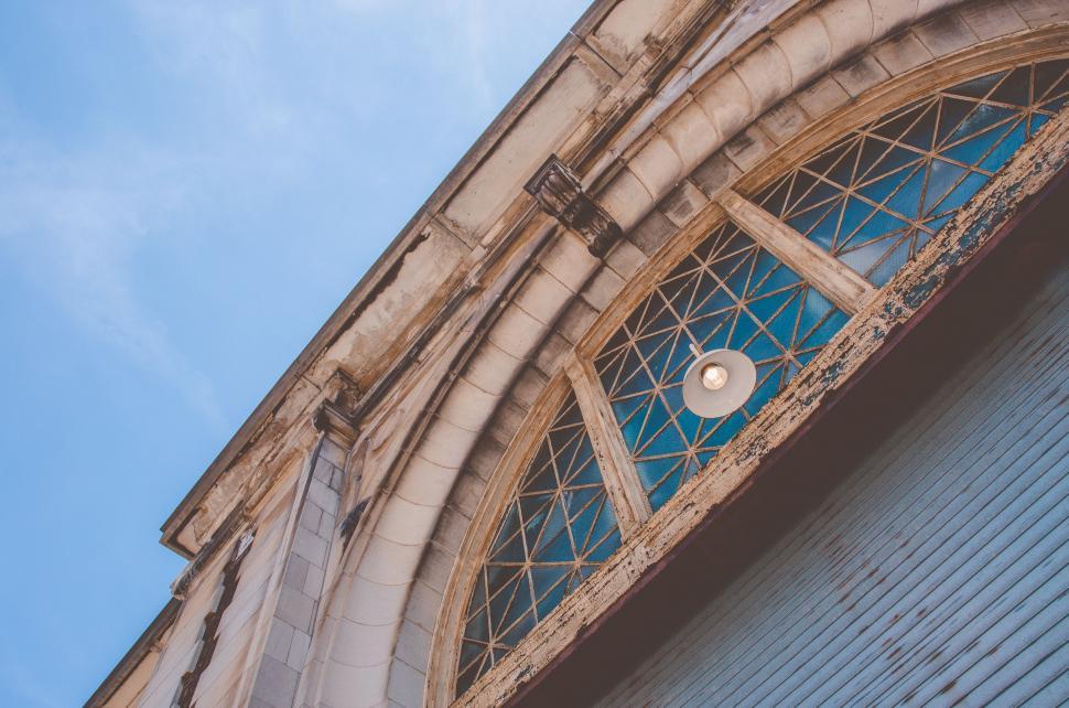 Free Image of Arched church window from a low angle 