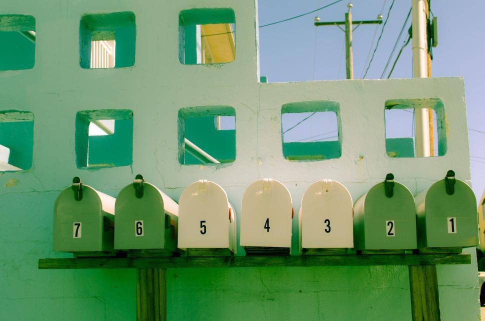 Free Image of Row of mailboxes with number tags 