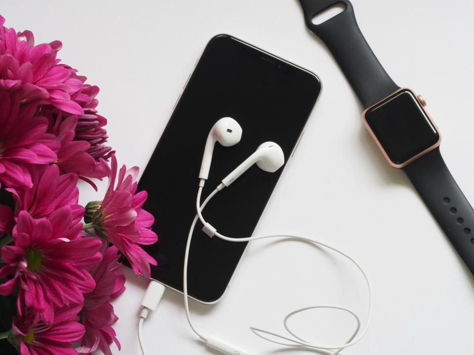 Free Stock Photo of Smartphone with headphones and smartwatch Download Free Images and Free Illustrations