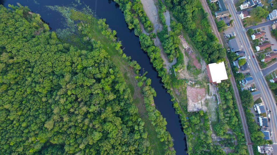 Free Image of Aerial view of river winding through greenery 