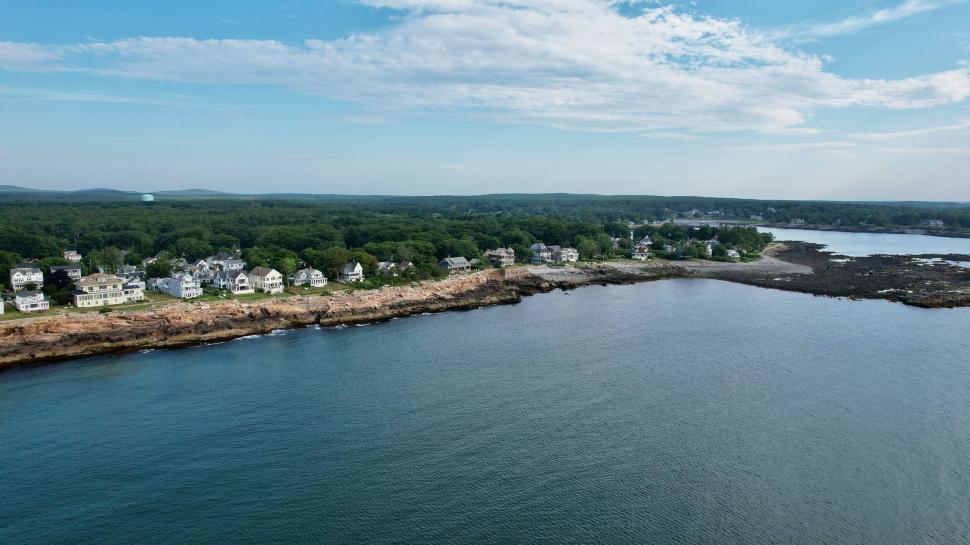 Free Image of Coastal neighborhood with rocky shoreline 