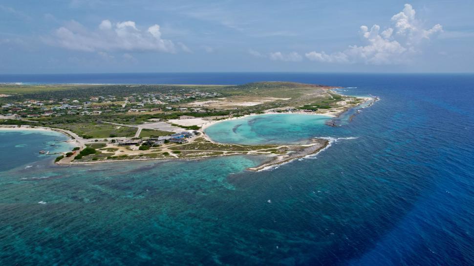 Free Image of Aerial view of coastal landscape with blue waters 