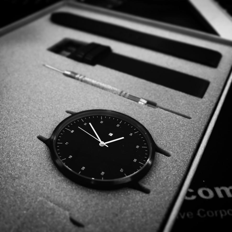 Free Image of Elegant wristwatch with tools and straps in packaging 