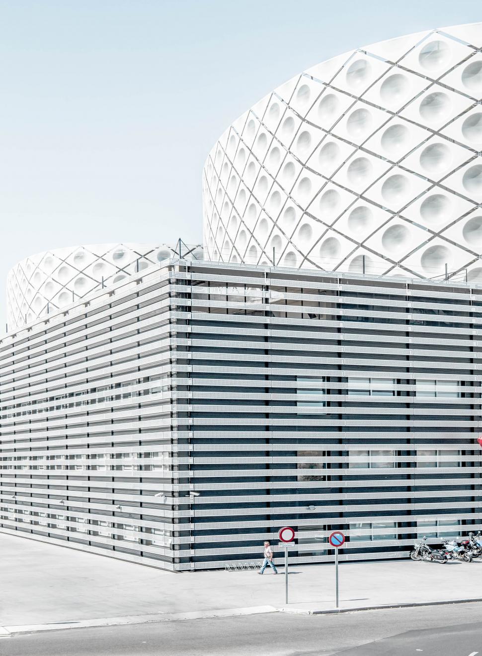 Free Image of Unique building with consistent stripe pattern facade. 