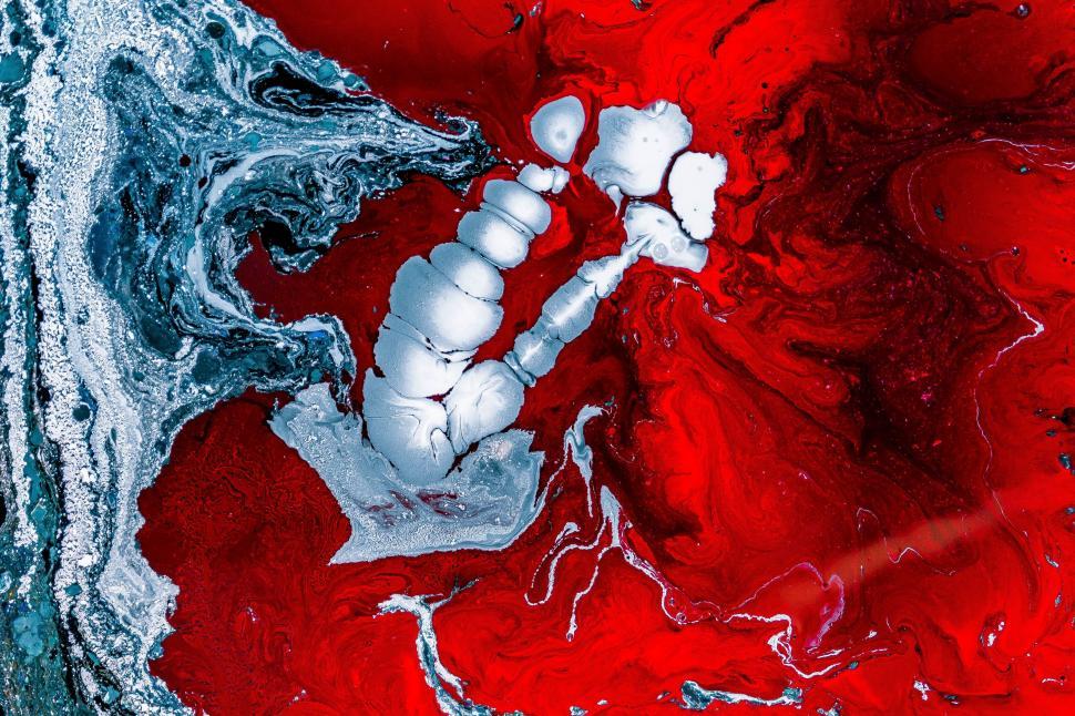 Free Image of Vibrant abstract image with red marbled, swirling patterns 