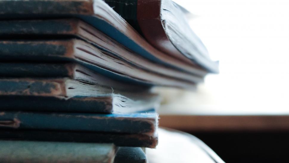 Free Image of Close-up of a stacked collection of old hardcover books 