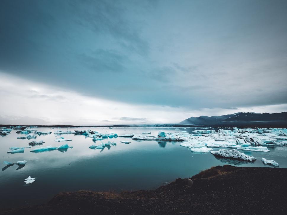 Free Stock Photo of Icy landscape with floating icebergs under cloudy ...