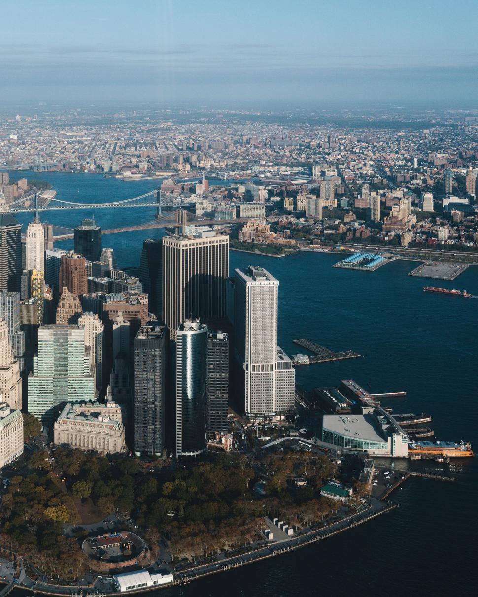 Free Image of Aerial view of a bustling city with river and bridges 