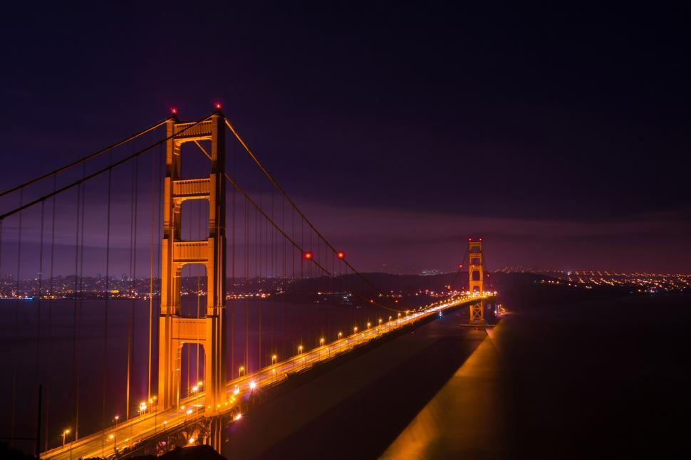 Free Image of Golden Gate Bridge illuminated against night sky 