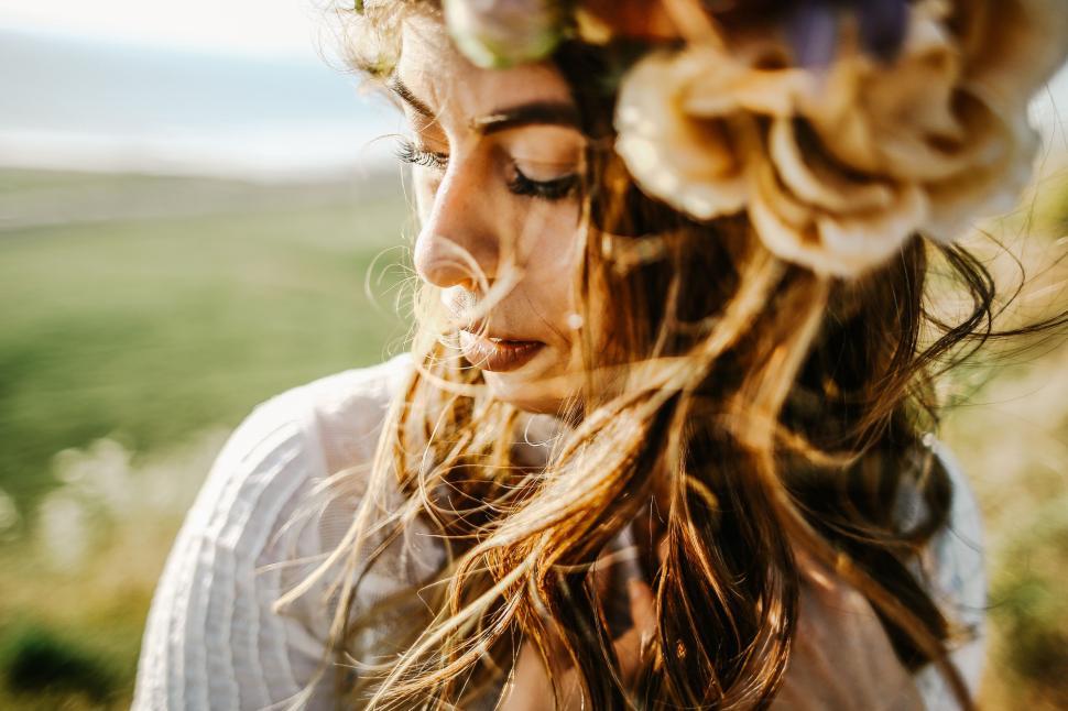 Free Image of Close-up shot of a woman s hair with floral crown 