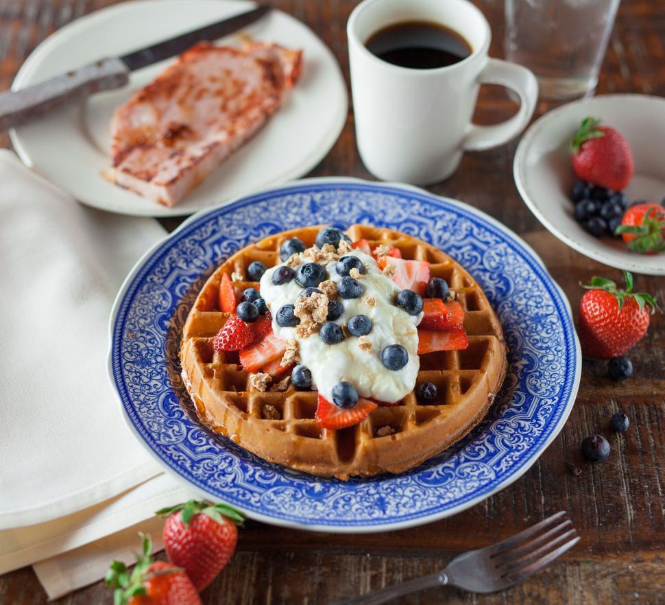 Free Image of Delicious waffle with toppings and a cup of coffee 