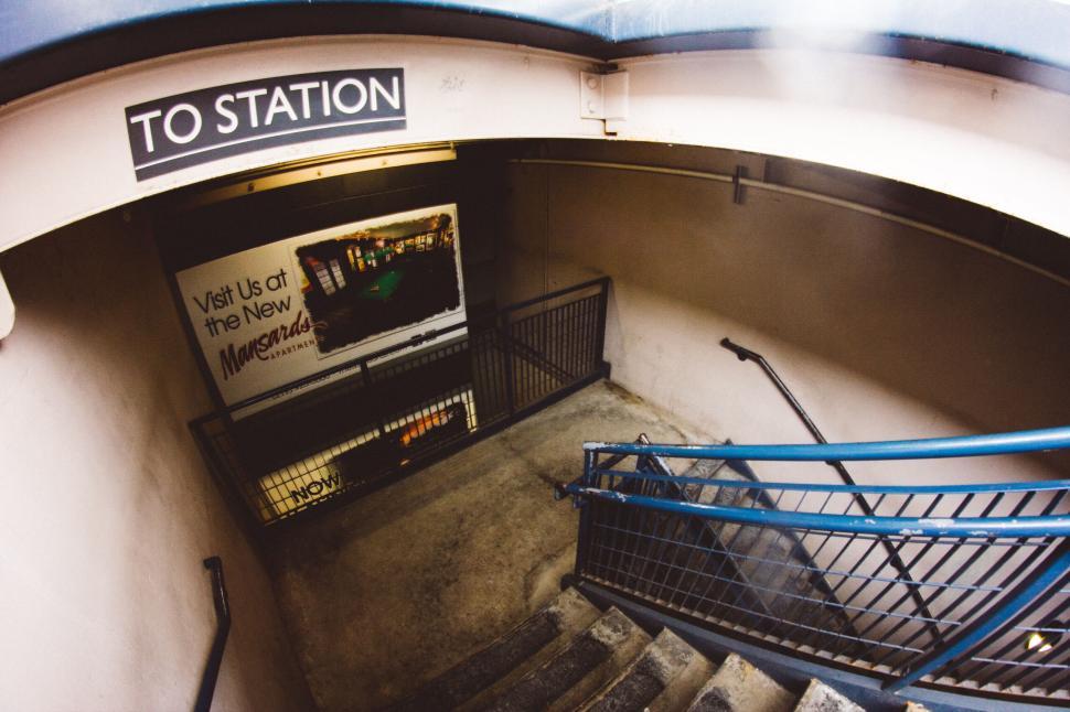 Free Image of Underground station entrance with stairs leading below 