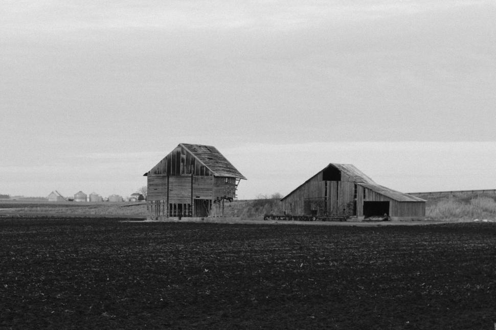 Free Image of Abandoned farm buildings stand isolated in rural landscape. 