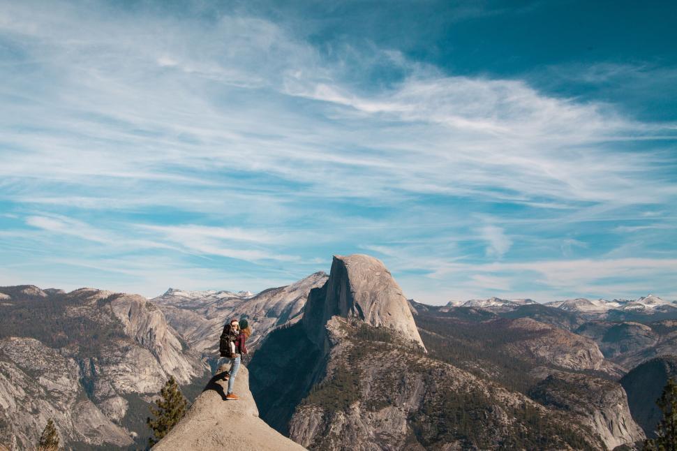 Free Image of Hiker on mountain peak with Yosemite valley background 