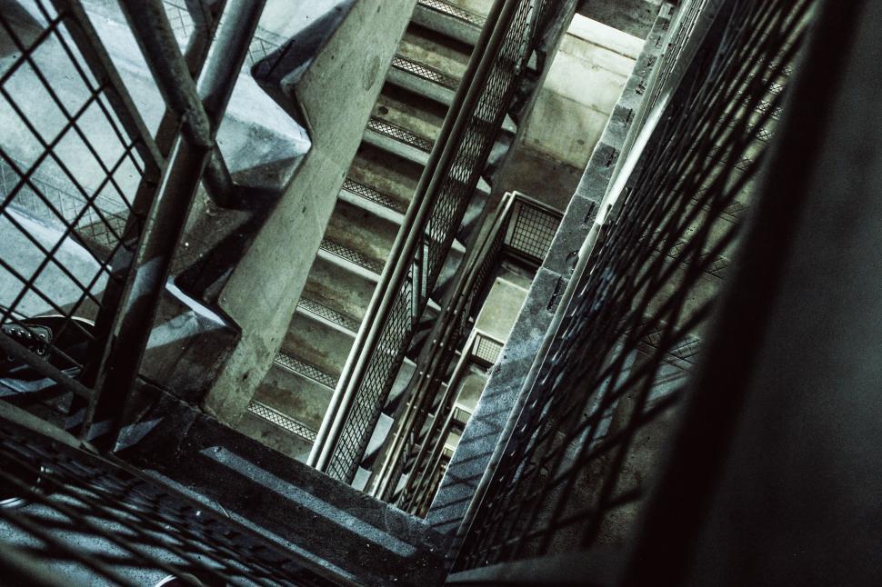 Free Image of Complex metal staircase with latticed railings in industrial setting 